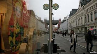 People walk past a store in central Moscow 12 November.