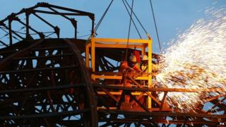 Workers cut through girders on Eastbourne Pier