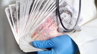 Doctor holding money