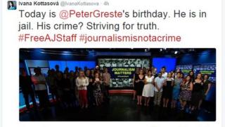A group of journalists gather in the CNN studio in front of a sign saying 'Journalism Matters'