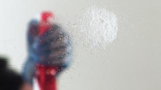 Person cleaning glass