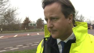 David Cameron standing by the A47 in Norfolk