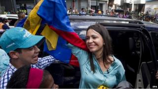 Venezuelan former legislator Maria Corina Machado (C) greets followers after a hearing at Attorney´s Office of Caracas over her alleged responsibility in a plan to kill Venezuelan President Nicolas Maduro, in Caracas, Venezuela, 03 December 2014. Machado