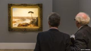 Two men looking at the painting at Sotheby's in November