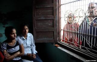 Indian sisters Pooja (L), 19, and Aarti, 22, are photographed at their home in the district of Sonepat on December 4, 2014.