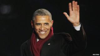 US President Barack Obama waves to the audience during the 92nd annual National Christmas Tree Lighting near the White House in Washington on 4 December 2014.