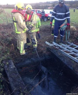 Two firemen attempt to rescue Chester