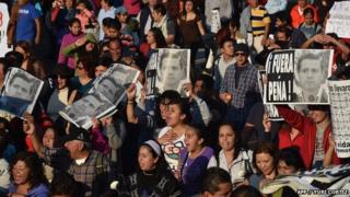 Protesters demand justice in the case of 43 missing students during a march in Mexico City.