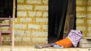 October 2014 photo, a man suffering from the Ebola virus near Freetown, Sierra Leone.