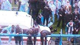 People climbing on the fences at Hillsborough