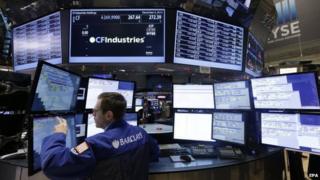 Traders work on the floor of the New York Stock Exchange (NYSE) at the start of the trading day in New York, New York, USA, 04 December 2014.