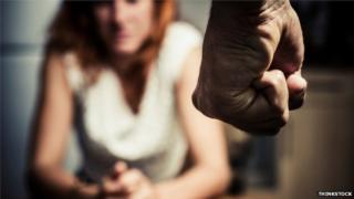 A man threatening a woman