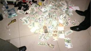 A pile of fake currency in Uganda