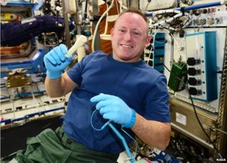 Mr Wilmore with the wrench