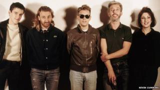 Rob Gretton (second from right) with New Order