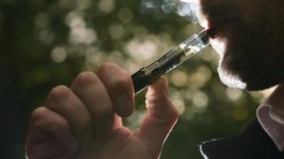 Man smoking an e-cigarette