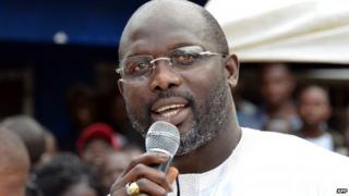 George Weah speaking at a campaign rally in Liberia