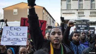 Protesters, demanding justice for Akai Gurley, march towards New York Police Department's (NYPD) 75th Precinct from the site of his shooting death in Brooklyn, New York 27 December 2014