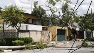 General view of a house hit by fallen trees and lamp posts close to Ibirapuera park due to an electric storm registered in Sao Paulo, Brazil, 29 December 2014