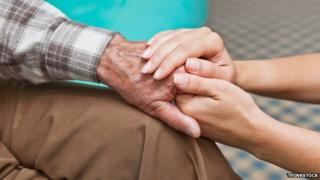 Elderly man receiving a home care visit