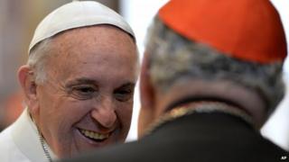 Pope Francis smiles as he meets with Cardinals in the Clementine hall at Vatican, Monday 22 December 2014