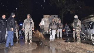 Lebanese Army soldiers patrol an area beside a cafe where a suicide bomb attack took place in Jabal Mohsen, Tripoli - 10 December 2015