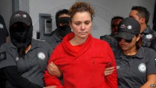 Maria de los Angeles Pineda (C), wife of former Mayor of Iguala, Jose Luis Abarca and allegedly connected to the case of forced disappearance of the 23 students on September 2014, guarded by Mexican authorities in Mexico City, Mexico, 12 January 2014.