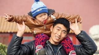Father and son on visit to Tiananmen Square in Beijing - 5 December, 2013