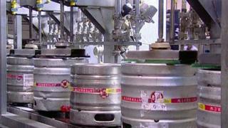 Beer kegs on production line