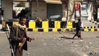 Armed Houthi in street in Sanaa