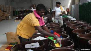 A Unicef worker assembles "school infection prevention kits" to stop the spread of Ebola in schools in Monrovia. Photo: 28 January 2015