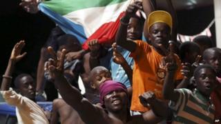 Equatorial Guinea fans celebrate on a street in Malabo, Equatorial Guinea after their national team beat Tunisia at their Africa Cup of Nations quarterfinal match, Saturday 31 January 2015