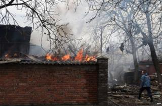 A house burns in the city of Donetsk after shelling, 3 February