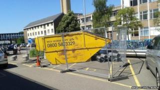 Skip using two disability parking spaces, Addenbrooke's Hospital, Cambridge
