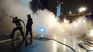 Firefighters using the ultra high pressure lance