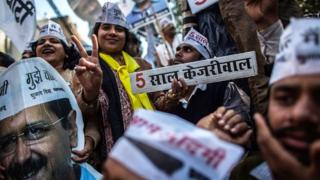 AAP supporters celebrate their party's win in Delhi state elections on 10 February 2015