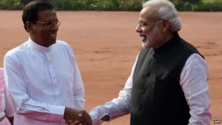 Sri Lankan President Maithripala Sirisena (L) shakes hands with Indian Prime Minister Narendra Modi during the welcome ceremony at the Presidential Palace in Delhi on February 16, 2015.