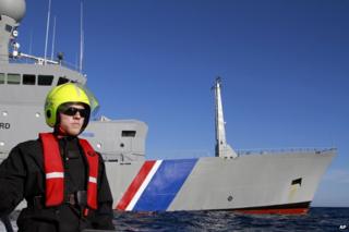 seaman Aron Asgeirsson circles the Icelandic Coast Guard ship Tyr during a routine exercise
