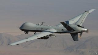 In this undated handout file photo provided by the U.S. Air Force, a MQ-9 Reaper, armed with GBU-12 Paveway II laser guided munitions and AGM-114 Hellfire missiles, is piloted by Col. Lex Turner during a combat mission over southern Afghanistan.