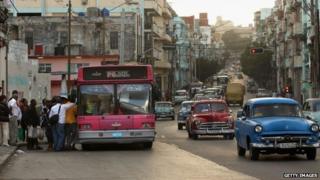 Cuban commuters line up to crowd onto a bus in Havana, Cuba on 26 January 2015