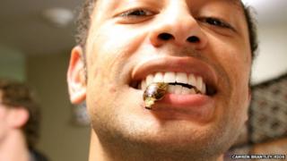 Camren Brantley-Rios eating a cockroach