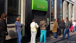 People queue outside a Job Centre in Bristol
