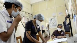 Indian medical staff work at the swine flu (H1N1) isolation ward of the Ahmedabad Civil Hospital in Ahmedabad on February 3, 2015