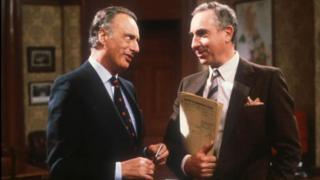 Actors Paul Eddington as fictional Prime Minister Jim Hacker, and Nigel Hawthorne as Sir Humphrey