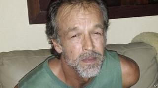 Victor Barnard sits in a police station after being detained at Pipa beach, in the northeastern state of Rio Grande do Norte, Brazil - 27 February 2015