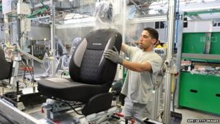 Worker in car assembly factory