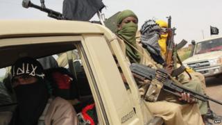 Ansar Dine militants at Kidal airport, northern Mali, 2012 photo