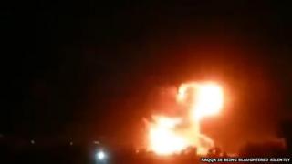 Video posted by Raqqa is Being Slaughtered Silently purportedly showing fireball in sky after air strike on oil refinery outside Tal Abyad, Syria (8 March 2015)