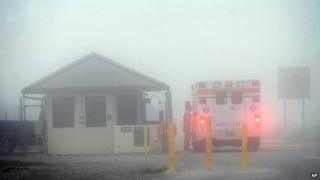 An Okaloosa County ambulance sits at the Eglin Air Force entrance in Fort Walton Beach, Florida 10 March 2015