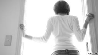 Woman standing at door